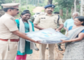 Police distribute tarpaulin sheets