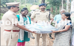 Police distribute tarpaulin sheets