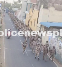 Parade with flag led by police